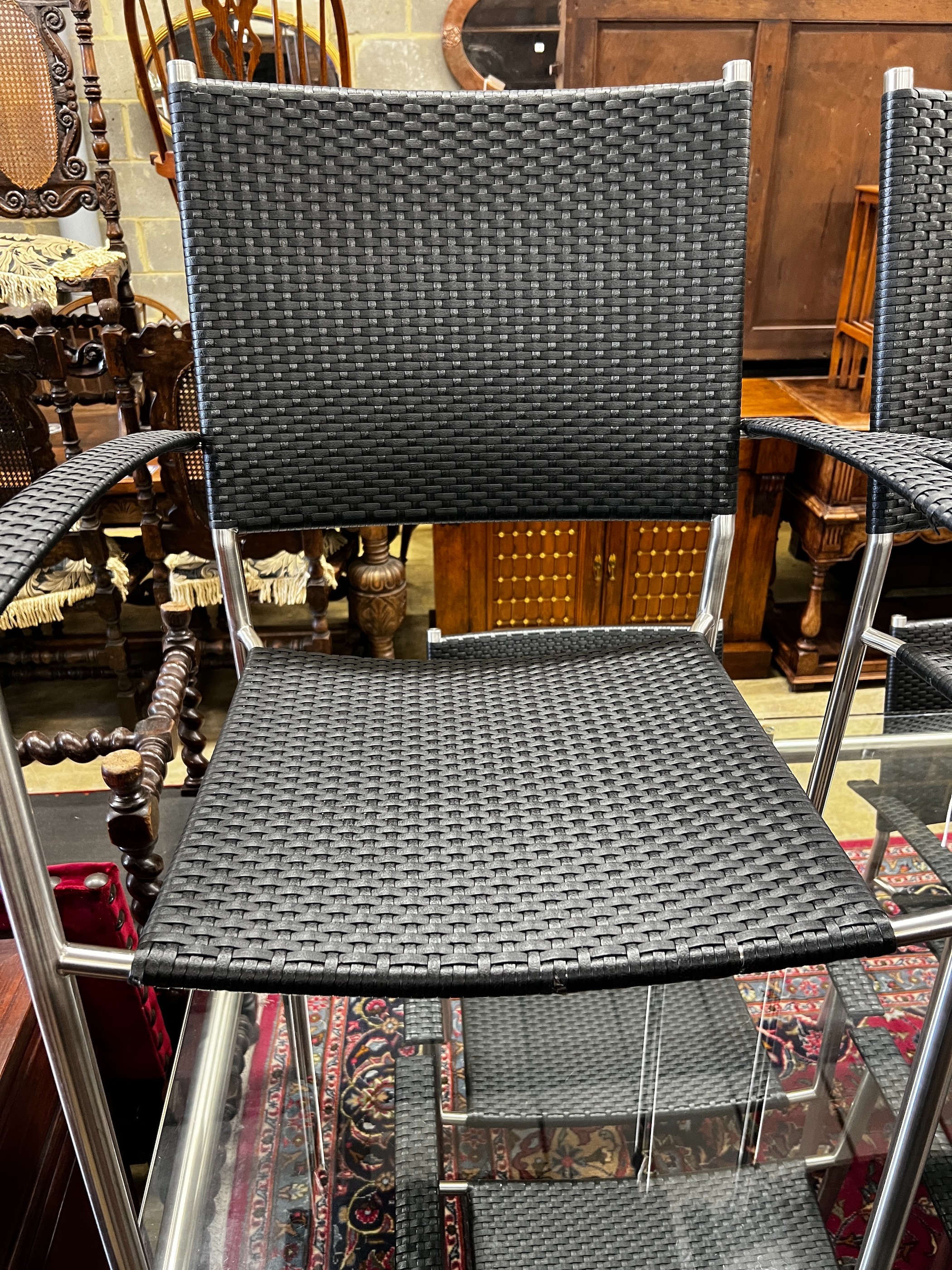 A contemporary Alexander Rose rectangular glass top garden table, length 159cm, depth 100cm, height 73cm and six 'all weather' rattan chairs, all with arms
